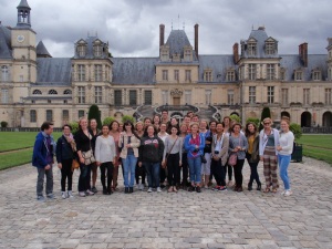A group photo outside Fontainebleu